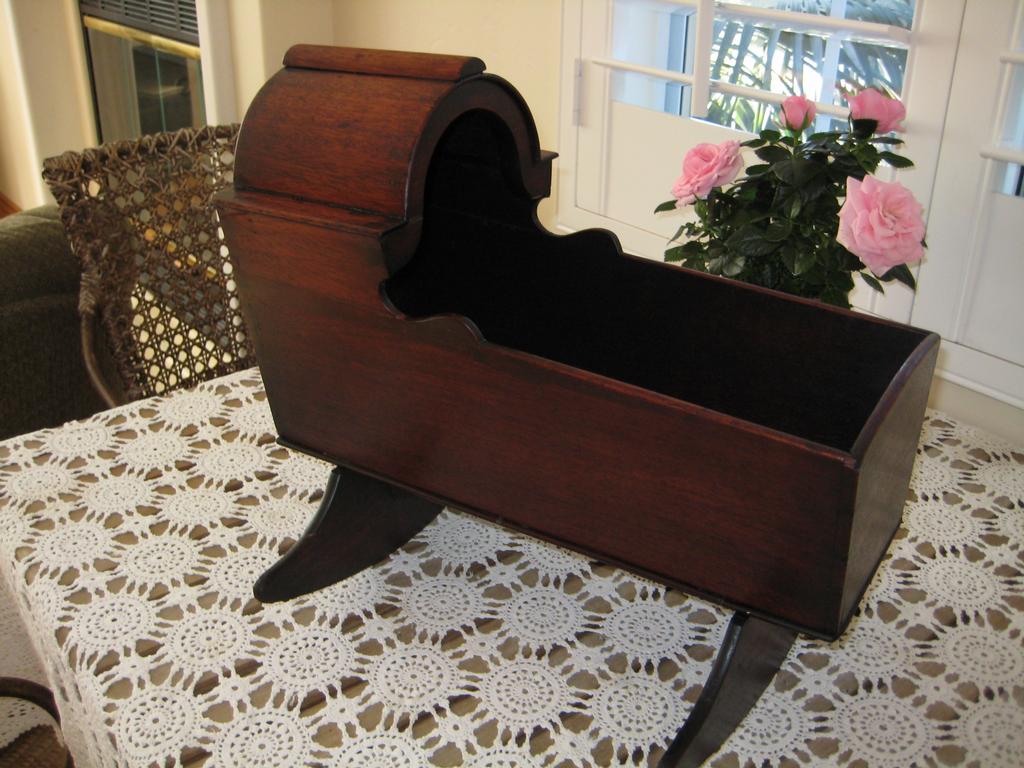 Antique doll cradle repaired and finish restored from Cane Specialties in Oceanside, CA 92054